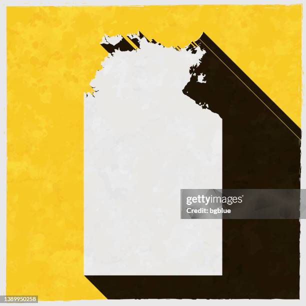 northern territory map with long shadow on textured yellow background - darwin stock illustrations