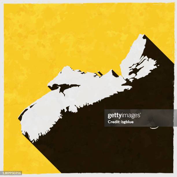 nova scotia map with long shadow on textured yellow background - halifax stock illustrations