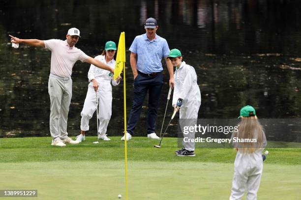 Sergio Garcia of Spain, wife Angela Garcia and Justin Rose of England during the Par Three Contest prior to the Masters at Augusta National Golf Club...