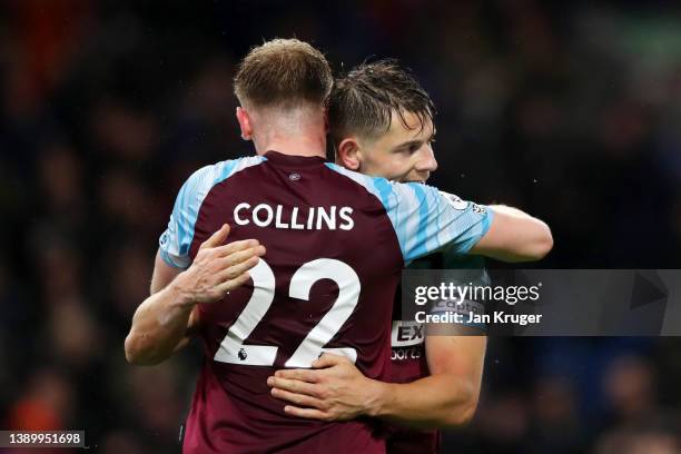 James Tarkowski and Nathan Collins of Burnley celebrate following their side's victory in the Premier League match between Burnley and Everton at...