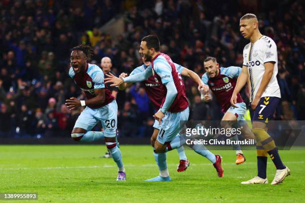 Maxwel Cornet of Burnley celebrates with teammate Dwight McNeil after scoring their team's third goal during the Premier League match between Burnley...