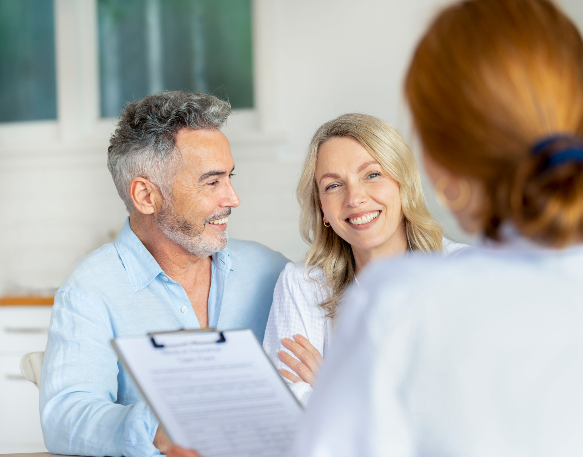 happy couple discussing medical results
