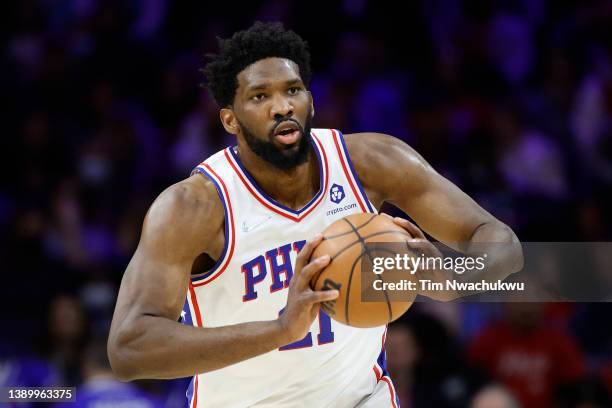 Joel Embiid of the Philadelphia 76ers passes against the Charlotte Hornets at Wells Fargo Center on April 02, 2022 in Philadelphia, Pennsylvania....