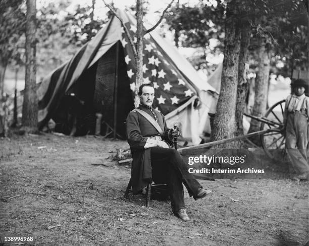 Seated portrait of Captain Cunningham , a member of General Thoma Francis Meagher , leader of the Union Army's Irish Brigade, while in Bealeton,...