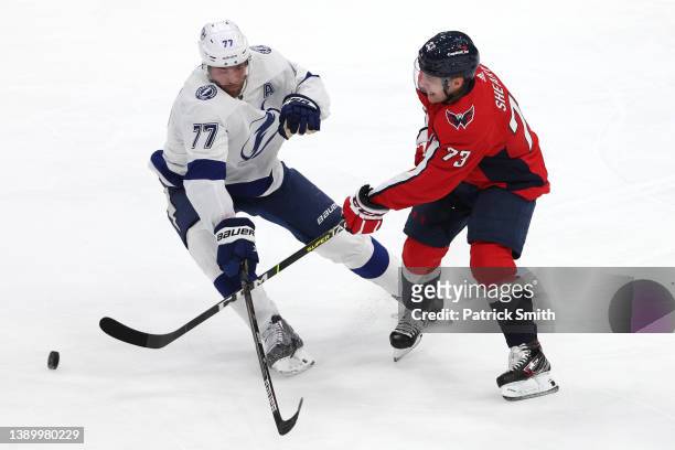 Victor Hedman of the Tampa Bay Lightning and Conor Sheary of the Washington Capitals battle for the puck during the first period at Capital One Arena...