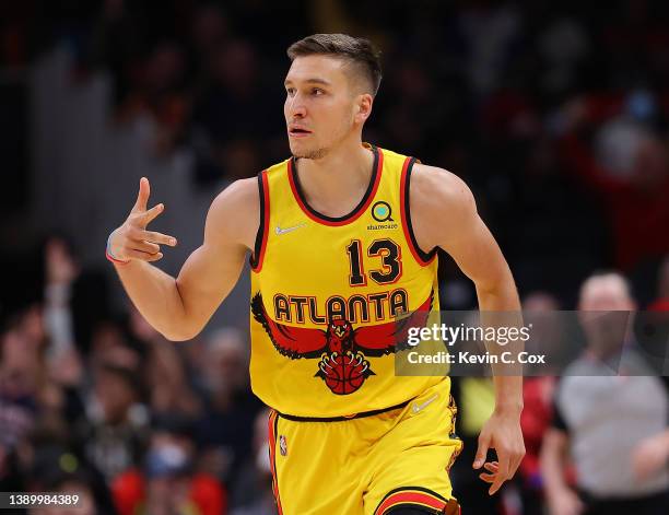 Bogdan Bogdanovic of the Atlanta Hawks reacts after hitting a three-point basket against the Washington Wizards during the first half at State Farm...