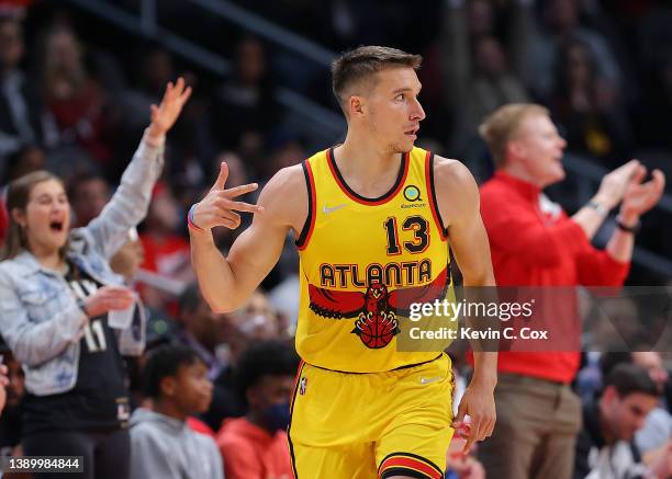 Bogdan Bogdanovic of the Atlanta Hawks reacts after hitting a three-point basket against the Washington Wizards during the first half at State Farm...