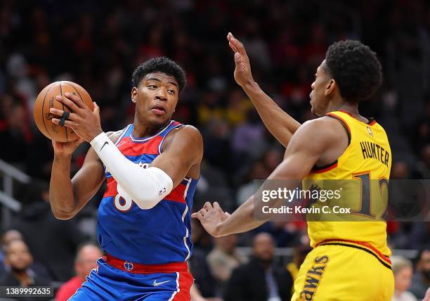 Rui Hachimura of the Washington Wizards drives against De'Andre Hunter of the Atlanta Hawks during the first half at State Farm Arena on April 06,...