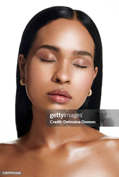 studio shot of an attractive young woman posing against white background - face close up bildbanksfoton och bilder