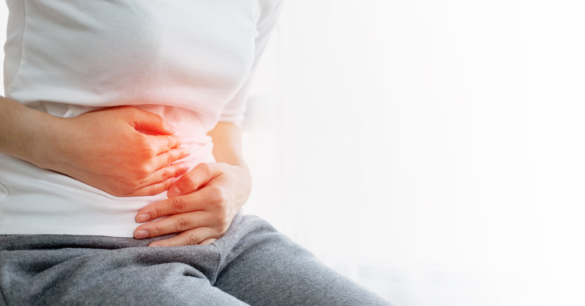 Young woman put her hand on her stomach because she had a very bad stomachache. Young woman put her hand on her stomach because she had a very bad stomachache.