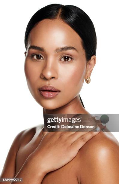 studio shot of an attractive young woman posing against white background - silky brown hair stock pictures, royalty-free photos & images