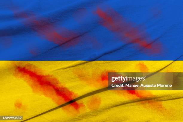blood-stained flag of ukraine - rebel flag backgrounds stock pictures, royalty-free photos & images