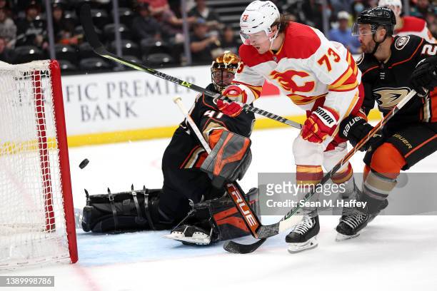Tyler Toffoli of the Calgary Flames scores a goal past the defense of Anthony Stolarz of the Anaheim Ducks during the second period of a game at...