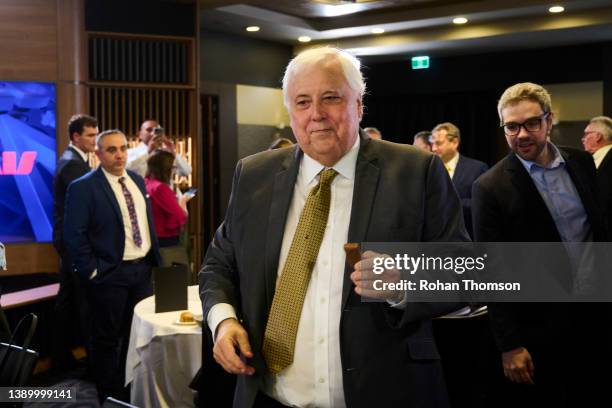 Clive Palmer, Chairman of The United Australia Party, holds a Tim Tam in his hand after delivering his National Press Club address at the National...