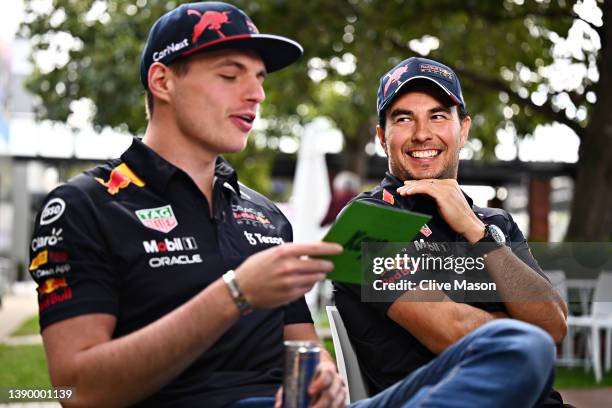 Sergio Perez of Mexico and Oracle Red Bull Racing and Max Verstappen of the Netherlands and Oracle Red Bull Racing talks to the media in the Paddock...