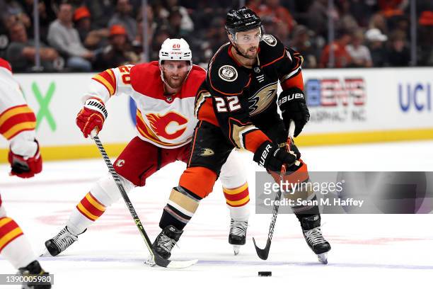 Kevin Shattenkirk of the Anaheim Ducks controls the puck past the defense of Blake Coleman of the Calgary Flames during the third period of a game at...