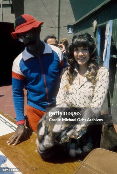 Comedian Bill Cosby and Barbi Benton check in at his celebrity tennis tournament on April 14, 1973 in Los Angeles, California.