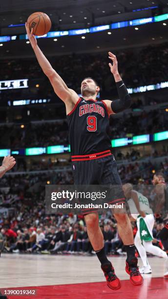Nikola Vucevic of the Chicago Bulls rebounds against the Boston Celtics at the United Center on April 06, 2022 in Chicago, Illinois. The Celtics...