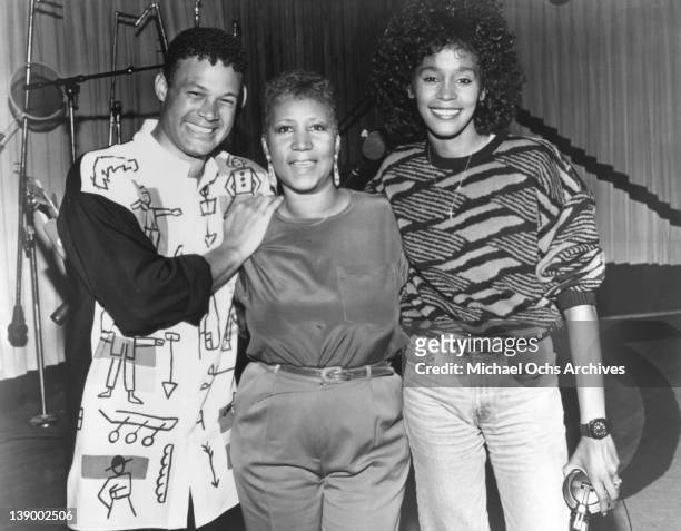 Producer and arranger Narrada Michael Walden, Aretha Franklin and Whitney Houston pose for a portrait during the recording of the song 'It Isn't, It...