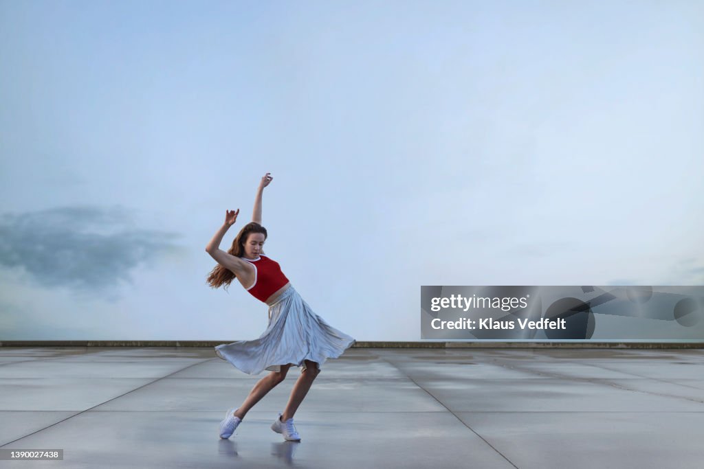 Ballerina dancing while practicing in skirt