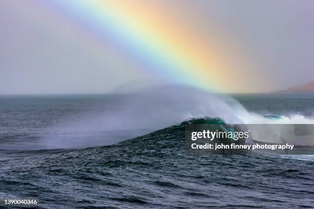 atlantic wave with rainbow. isle of harris, scotland - western isles stock pictures, royalty-free photos & images