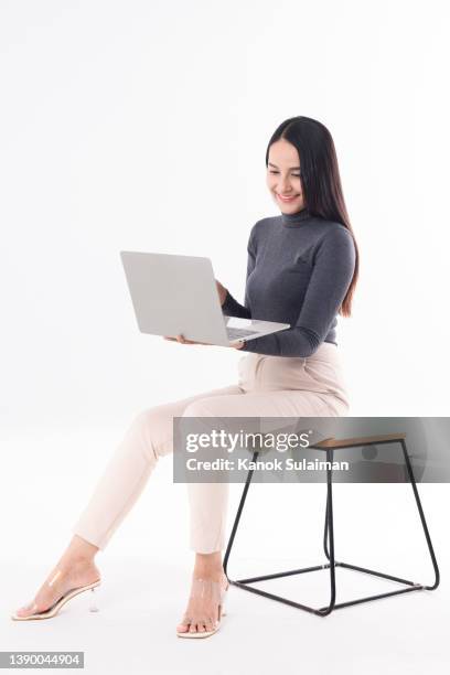 successful young businesswoman - profile laptop sitting stock-fotos und bilder