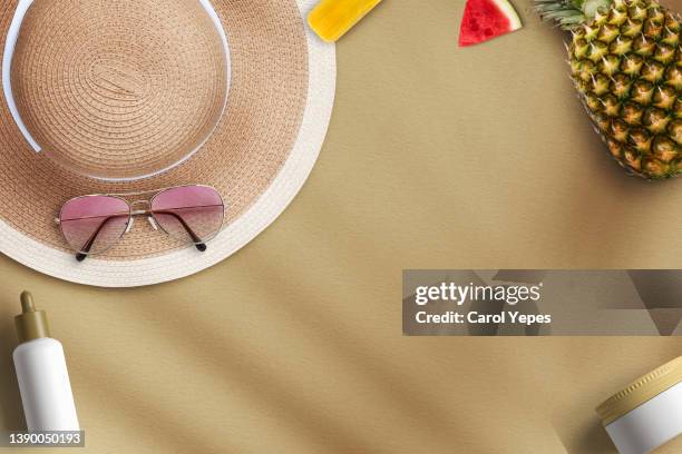 stylish feminine flat lay table top still life. with sun hat, summer items and starfish, sand , towel - sunglasses overhead fotografías e imágenes de stock