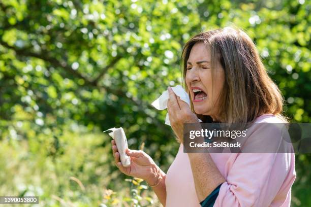 sneezing with allergies - hayfever stock pictures, royalty-free photos & images