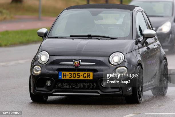 dutch black 2016 "abarth 500" approaching in enschede - fiat logo stock pictures, royalty-free photos & images