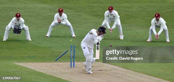 Ben Charlesworth of Gloucestershire is bowled by Ben Sanderson during the LV= Insurance County Championship match between Northamptonshire and...