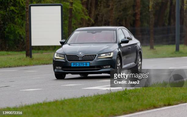 dutch gray 2017 skoda superb taxi driving in enschede - skoda auto stock pictures, royalty-free photos & images
