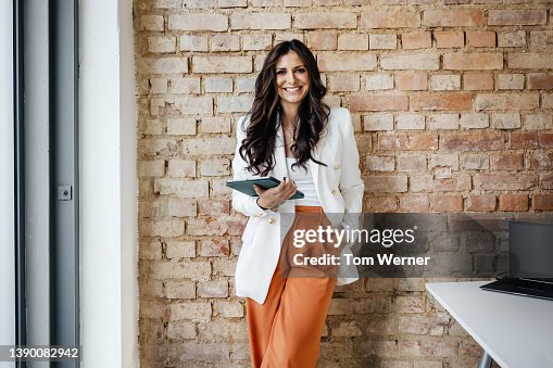 Portrait Of Small Business Employee Holding Digital Tablet Portrait Of Small Business Employee Holding Digital Tablet