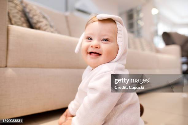 down syndrome baby laughing to the camera - down syndrome baby stockfoto's en -beelden