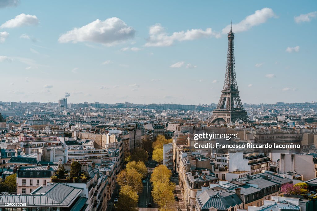 Eiffel Tower and the buildings of Paris, high point of view. Champs Elysees, France, Europe