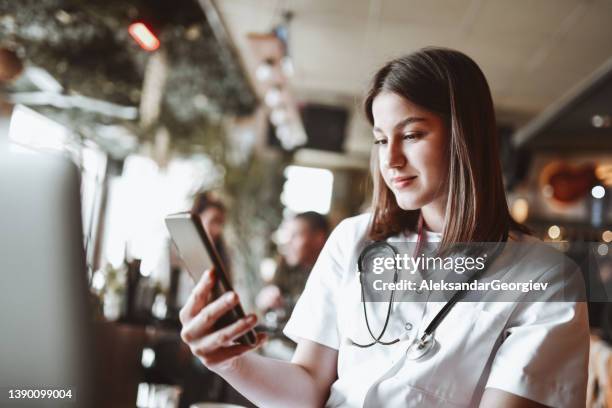 Nurse Using Camera Nurse And Looking At The Camera Photos and Premium High Res Pictures ...