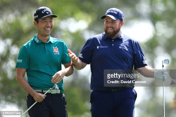 Kevin Na and Shane Lowry of Ireland react to Lowry's shot from the fourth tee during the first round of the Masters at Augusta National Golf Club on...