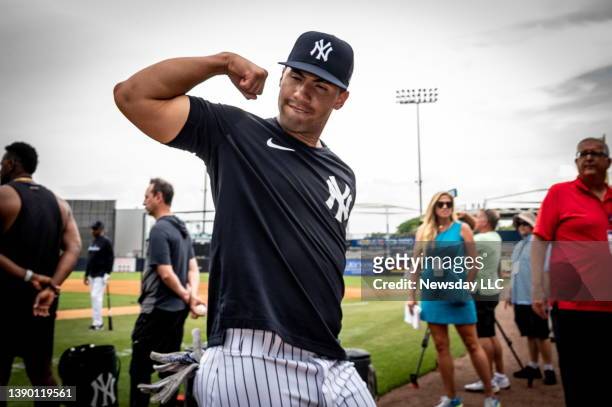 New York Yankees' second baseman Gleyber Torres flexing his muscles as he leaves the field after batting practice before the team's game against the...