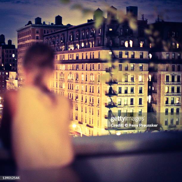 woman standing on terrace - reny preussker imagens e fotografias de stock