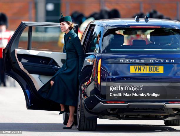 Catherine, Duchess of Cambridge gets out of her chauffeur driven Range Rover car as she attends the annual St. Patrick's Day parade at Mons Barracks...
