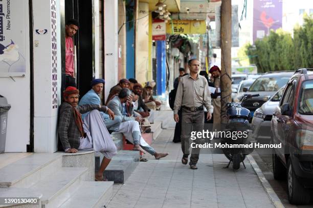 Yemeni people are seen on the street, on the day the country has witnessed a progressive political process as they try to end the war, on April 07,...