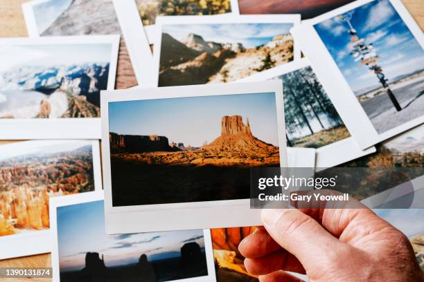 assortment of instant travel holiday photos on a table - photo collage imagens e fotografias de stock