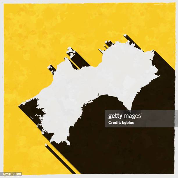 shikoku map with long shadow on textured yellow background - matsuyama ehime stock illustrations