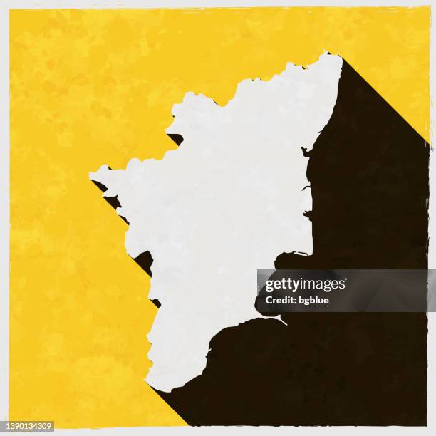 tamil nadu map with long shadow on textured yellow background - chennai stock illustrations