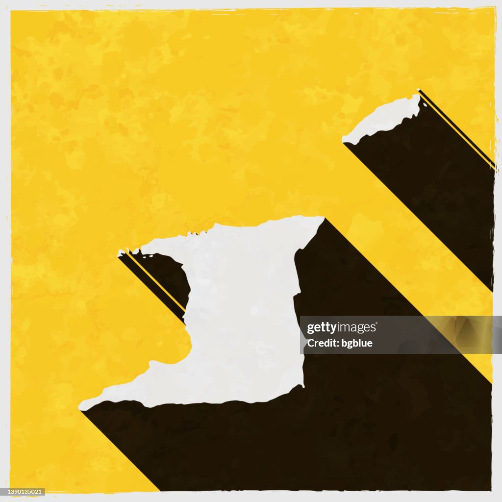 Mapa de Trinidad y Tobago con sombra larga sobre fondo amarillo texturizado