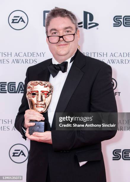 Iain Brown from Hello Games with the award for Evolving Game for "No Man’s Sky" during the British Academy Games Awards 2022 at the Queen Elizabeth...