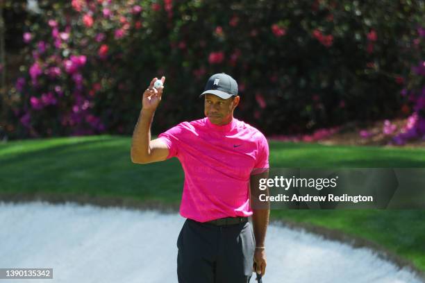 Tiger Woods reacts after making birdie on the 13th green during the first round of the Masters at Augusta National Golf Club on April 07, 2022 in...