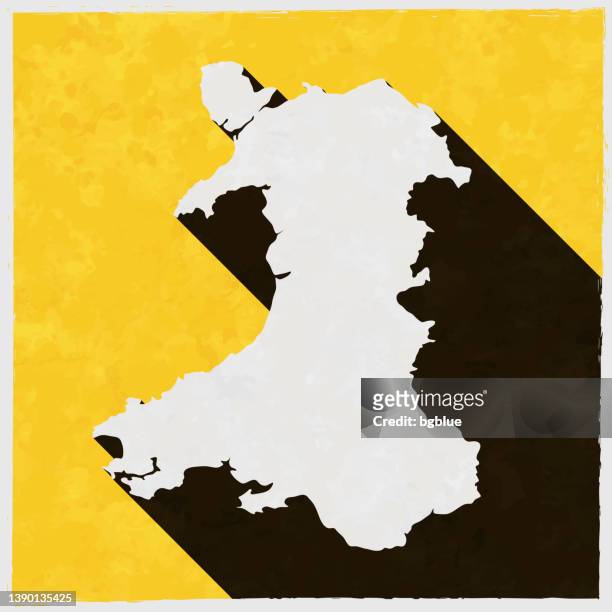 ilustrações de stock, clip art, desenhos animados e ícones de wales map with long shadow on textured yellow background - país de gales