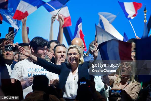 France's far-right party Rassemblement National leader, Marine Le Pen candidate for the 2022 French presidential election greets her supporters at...