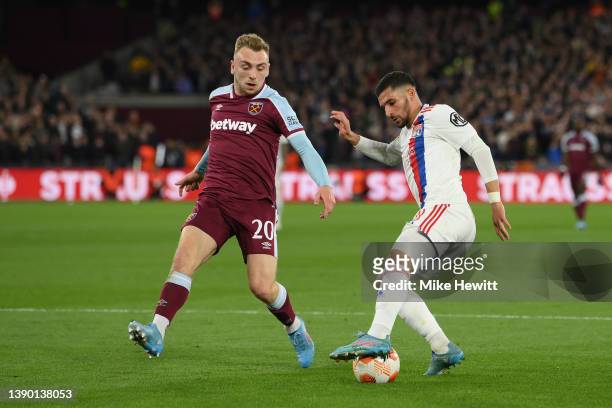 Houssem Aouar of Olympique Lyonnais controls the ball whilst under pressure from Jarrod Bowen of West Ham United during the UEFA Europa League...