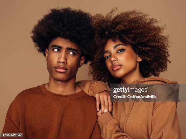 happy brother and sister with afro hairstyle - adult siblings stock pictures, royalty-free photos & images